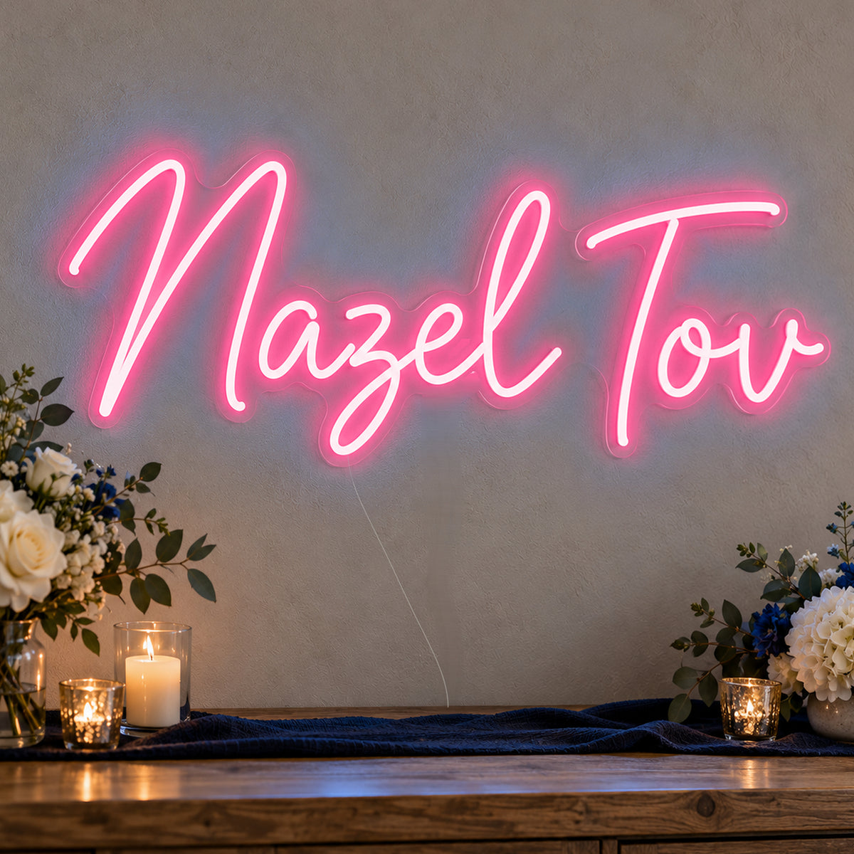 Mazel Tov Blue Neon Sign in rose red LED neon on clear acrylic, angled view
