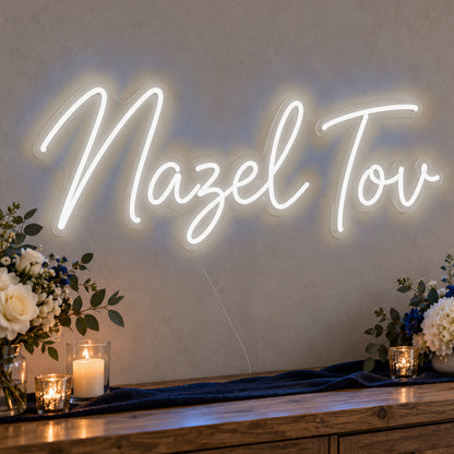 Mazel Tov Blue Neon Sign in white LED neon on clear acrylic, angled view