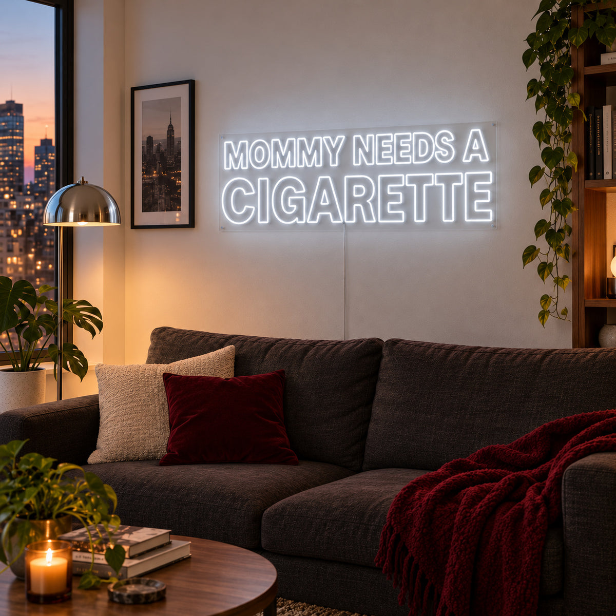 Mommy Needs A Cigarette Neon Sign, RGB colour-changing option shown in white above a brown sofa.