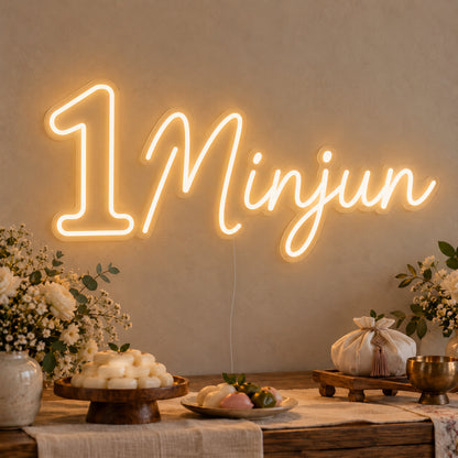 Personalised Name One Neon Sign on clear cut-to-shape acrylic in an illuminated wall display; example personalisation shown.