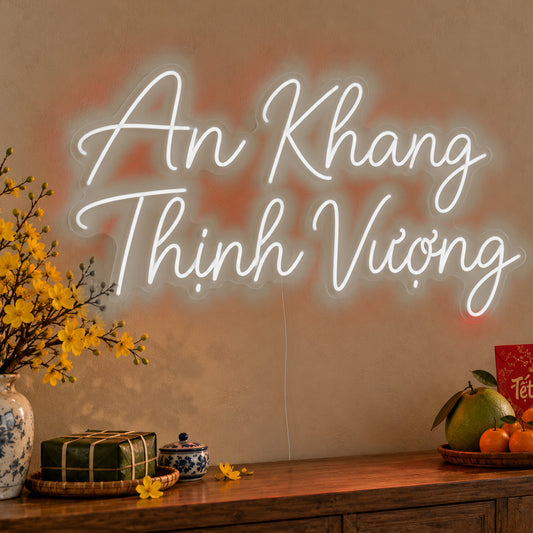 An Khang Thịnh Vượng Neon Sign in white LED neon on clear acrylic, angled view