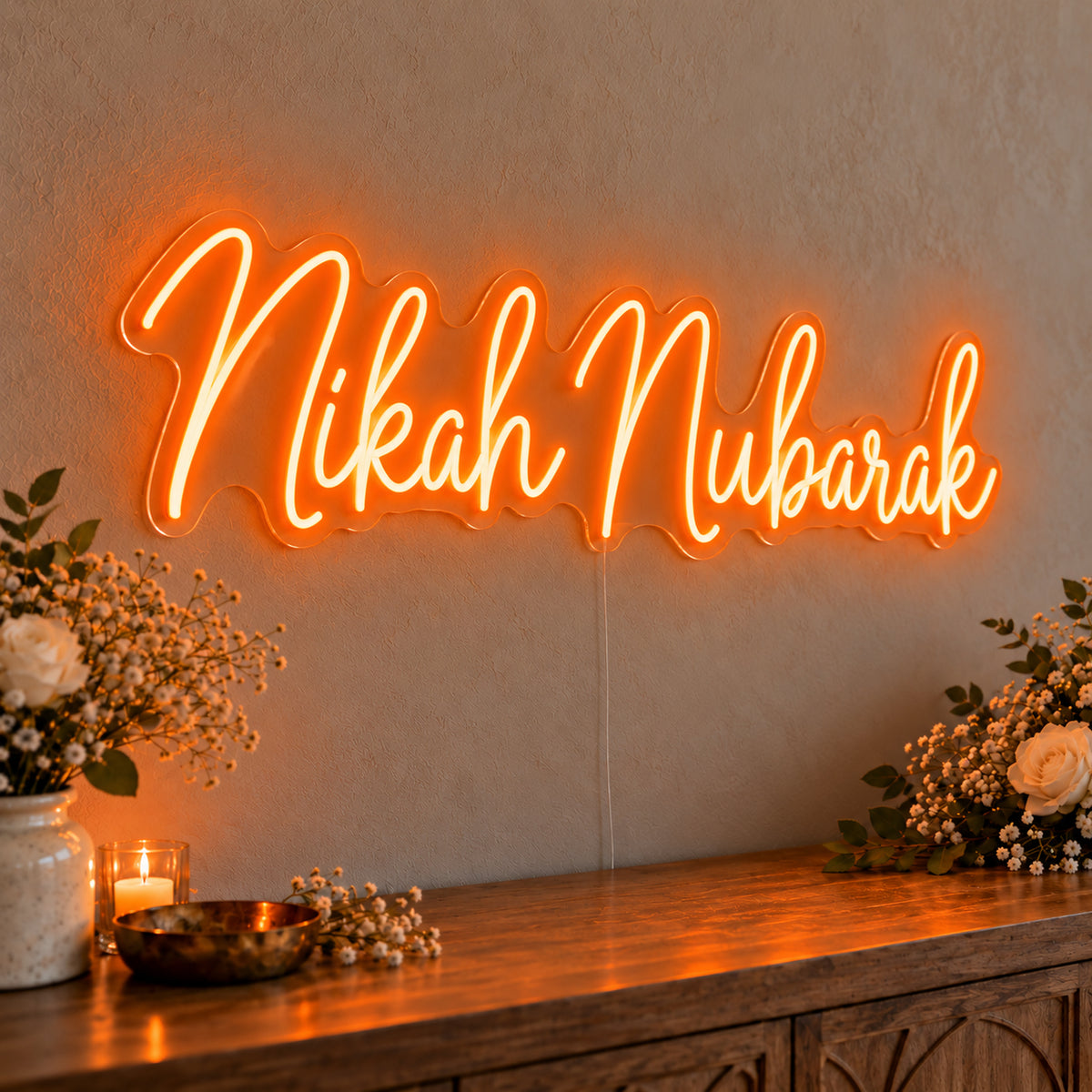 Nikah Mubarak Neon Sign in orange LED neon on clear acrylic, angled view