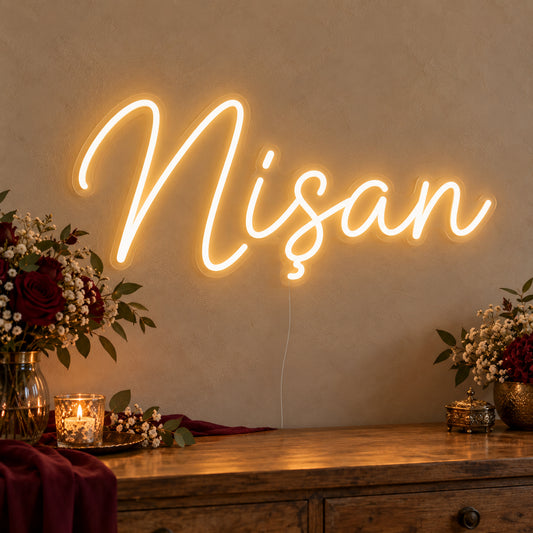Nişan Neon Sign on clear cut-to-shape acrylic, illuminated on a wall in a styled celebration setting