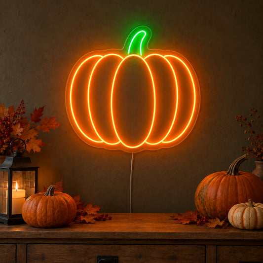Orange Pumpkin Neon Sign featuring an orange pumpkin outline with curved segments and a green stem, glowing on a dark wall in a Halloween room display.