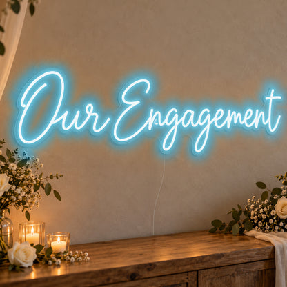 Our Engagement Neon Sign in ice blue LED neon on clear acrylic, angled view