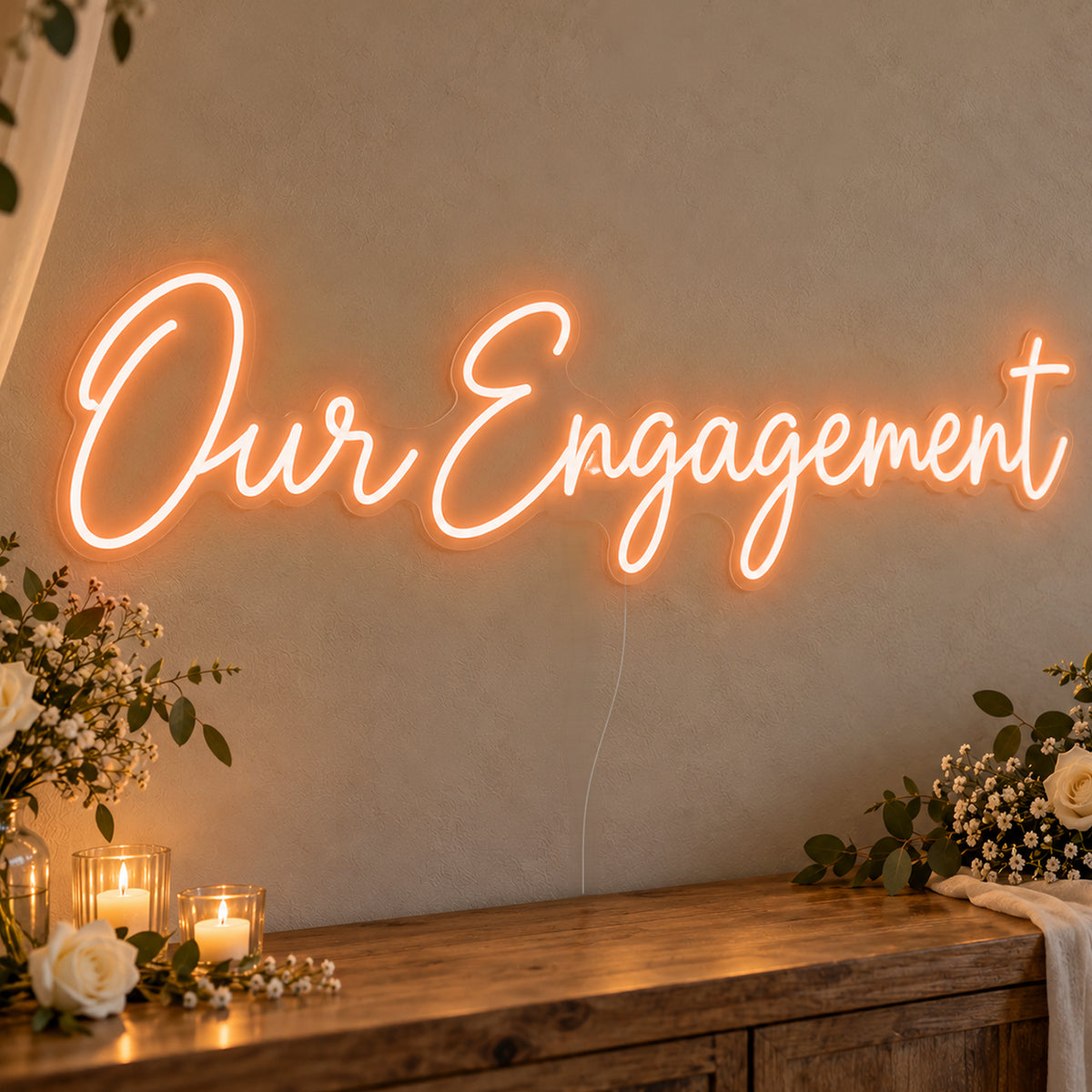Our Engagement Neon Sign in orange LED neon on clear acrylic, angled view