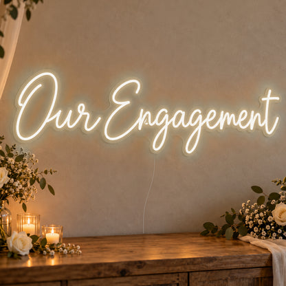 Our Engagement Neon Sign in warm white LED neon on clear acrylic, angled view