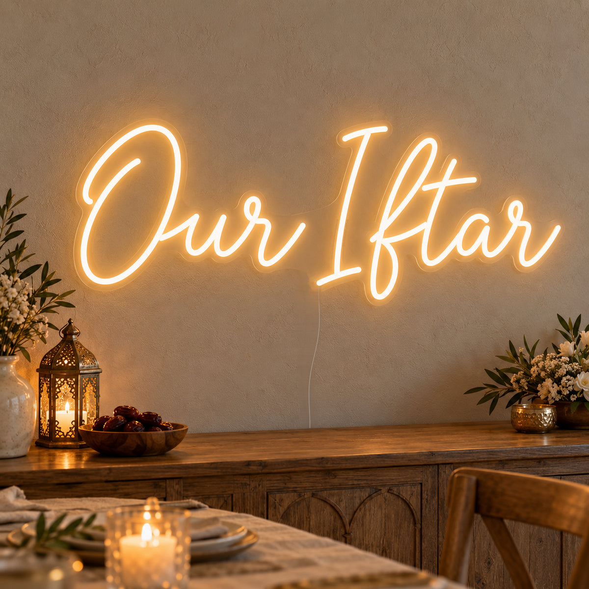 Our Iftar Neon Sign on clear cut-to-shape acrylic, illuminated on a wall in a styled celebration setting