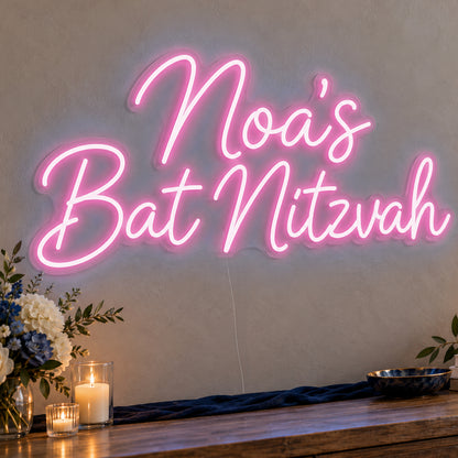 Personalised Bat Mitzvah Neon Sign in pink LED neon on clear acrylic, angled view
