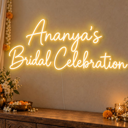 Personalised Bridal Celebration Neon Sign in gold LED neon on clear acrylic, angled view