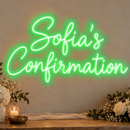 Personalised Confirmation Neon Sign in green LED neon on clear acrylic, angled view