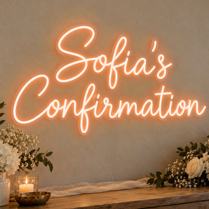 Personalised Confirmation Neon Sign in orange LED neon on clear acrylic, angled view