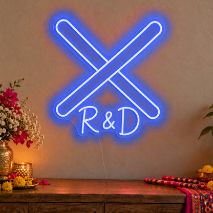 Personalised Dandiya Initials Neon Sign in blue LED neon on clear acrylic, angled view