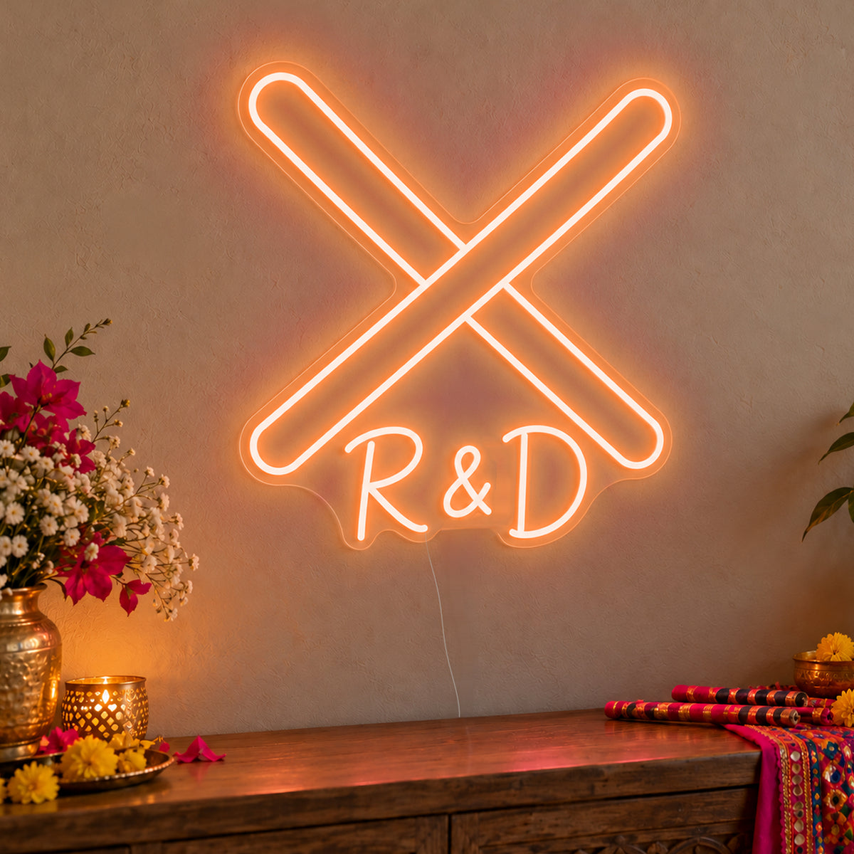 Personalised Dandiya Initials Neon Sign in orange LED neon on clear acrylic, angled view