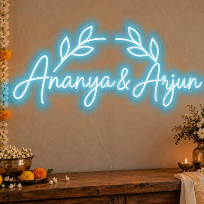 Personalised Floral Arch Names Neon Sign in ice blue LED neon on clear acrylic, angled view