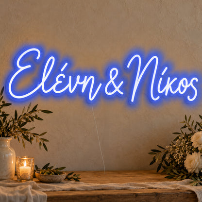 Personalised Greek Couple Names Neon Sign in blue LED neon on clear acrylic, angled view