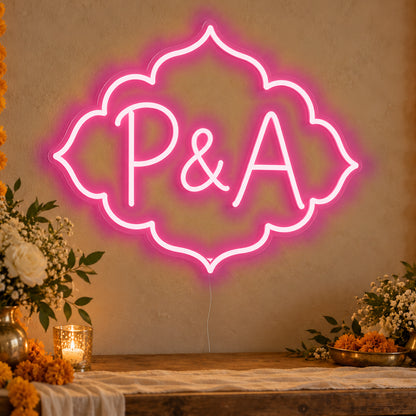 Personalised Marigold Initials Neon Sign in rose red LED neon on clear acrylic, angled view