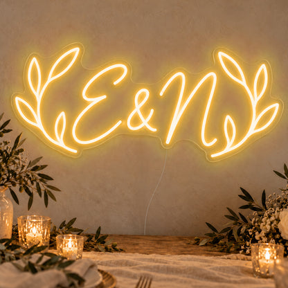 Personalised Olive Initials Neon Sign in gold LED neon on clear acrylic, angled view