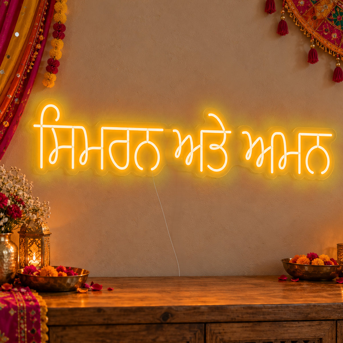 Personalised Punjabi Couple Names Neon Sign in gold LED neon on clear acrylic, angled view