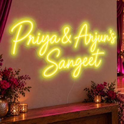 Personalised Sangeet Neon Sign in yellow LED neon on clear acrylic, angled view