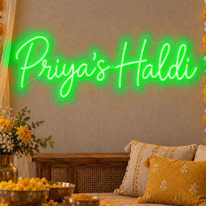 Personalised Haldi Neon Sign in green LED neon on clear acrylic, angled view