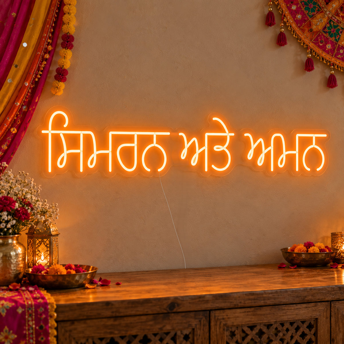 Personalised Punjabi Couple Names Neon Sign on clear cut-to-shape acrylic in an illuminated wall display; example personalisation shown.