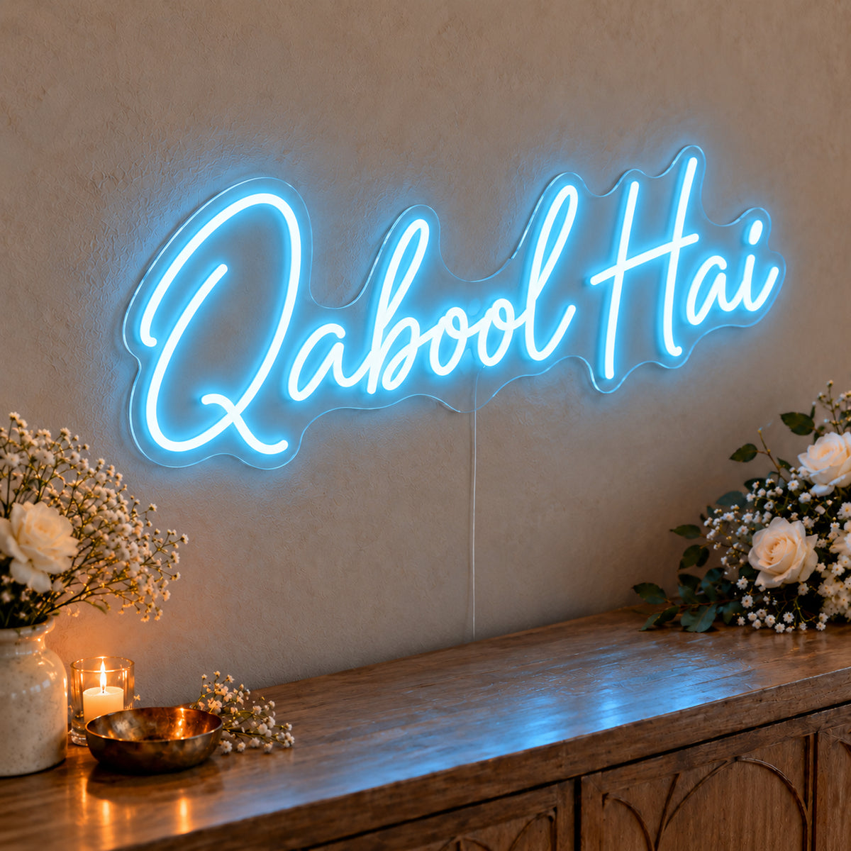 Qabool Hai Neon Sign in ice blue LED neon on clear acrylic, angled view