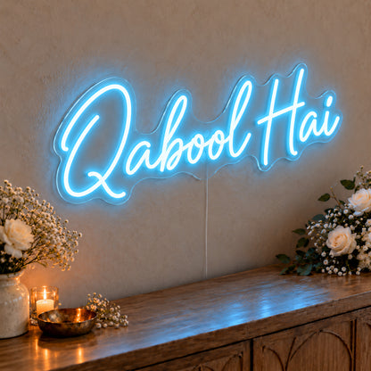 Qabool Hai Neon Sign in ice blue LED neon on clear acrylic, angled view
