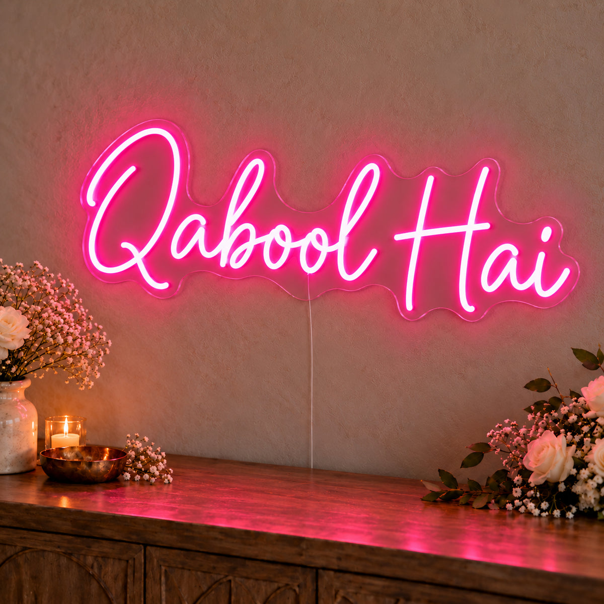 Qabool Hai Neon Sign in rose red LED neon on clear acrylic, angled view