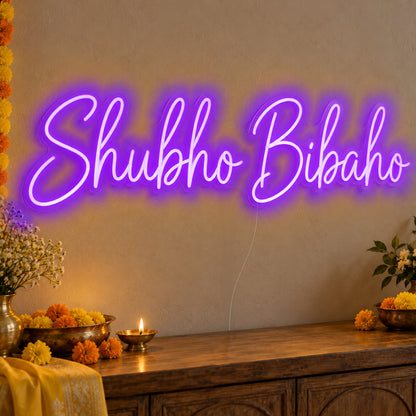 Shubho Bibaho Neon Sign in purple LED neon on clear acrylic, angled view