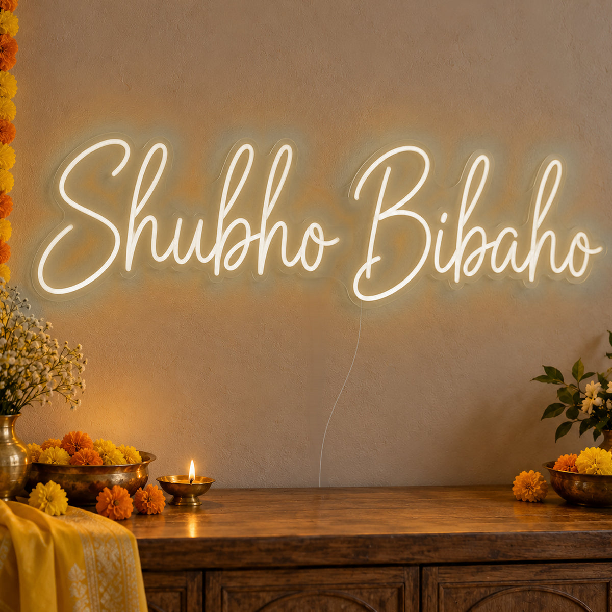 Shubho Bibaho Neon Sign in warm white LED neon on clear acrylic, angled view