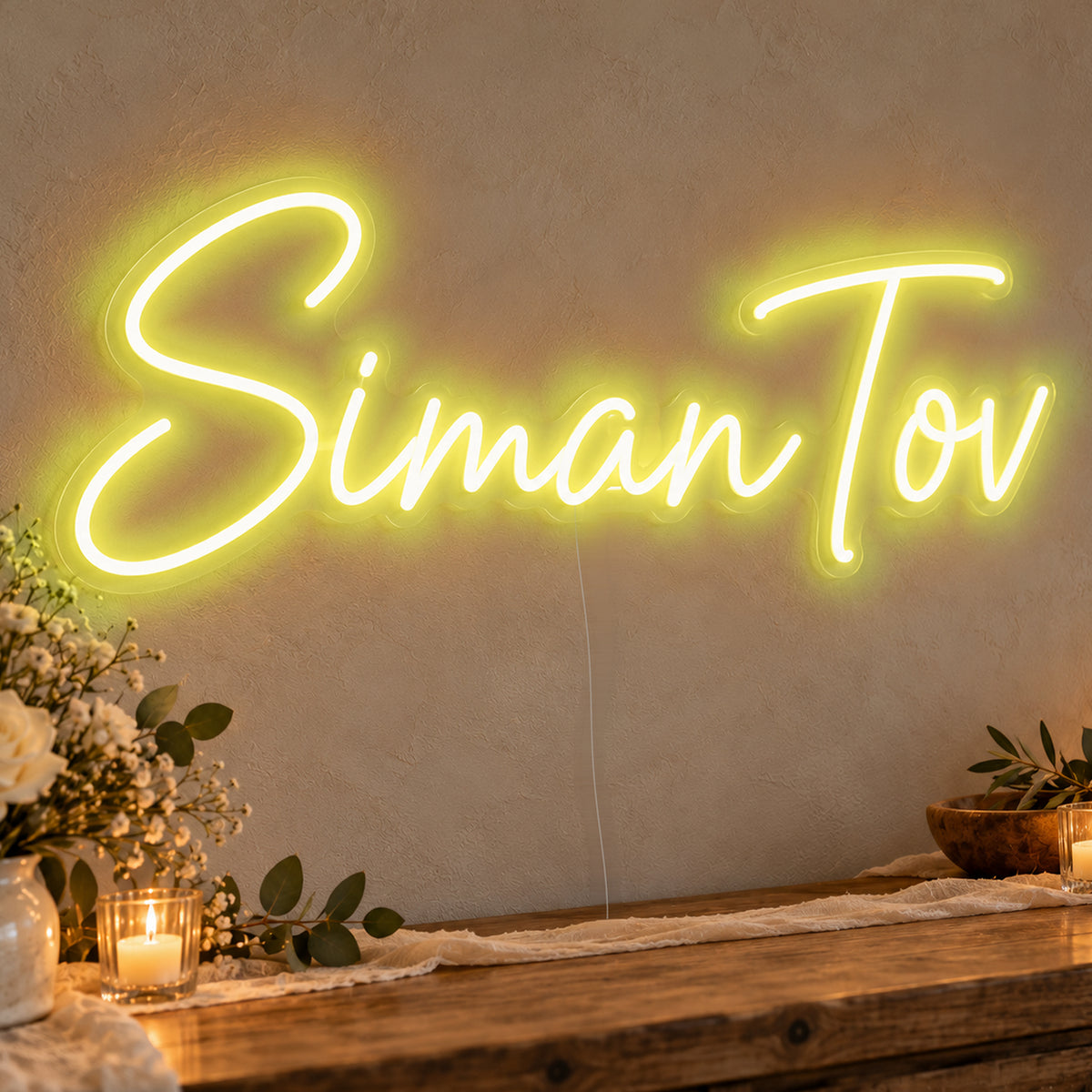 Siman Tov Neon Sign in yellow LED neon on clear acrylic, angled view