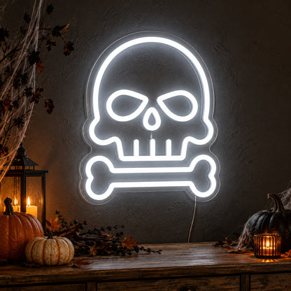 Skull and Bone Neon Sign featuring a white skull outline above a single horizontal bone, glowing on a dark wall in a Halloween room display.