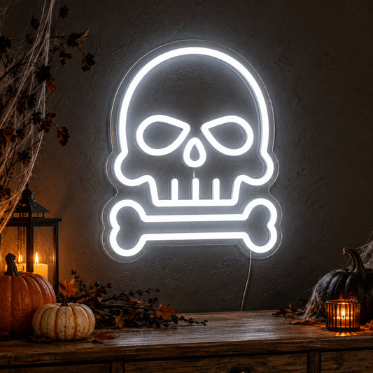 Skull and Bone Neon Sign featuring a white skull outline above a single horizontal bone, glowing on a dark wall in a Halloween room display.