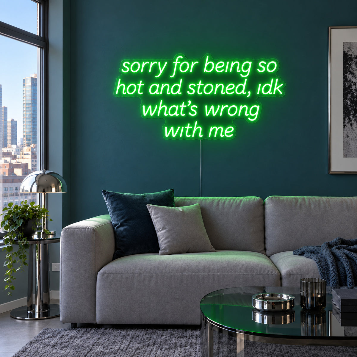 Sorry For Being So Hot And Stoned, Idk What's Wrong With Me Neon Sign with green lighting, displayed above a grey sofa against a blue wall.