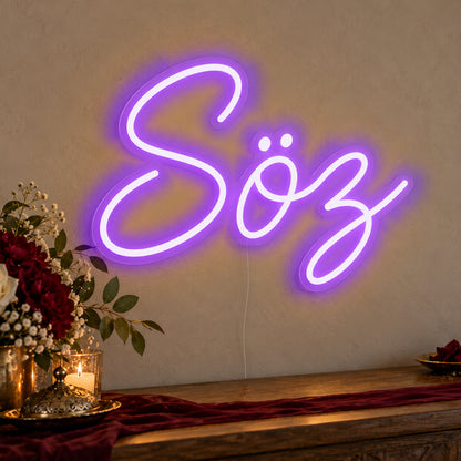 Söz Neon Sign in purple LED neon on clear acrylic, angled view