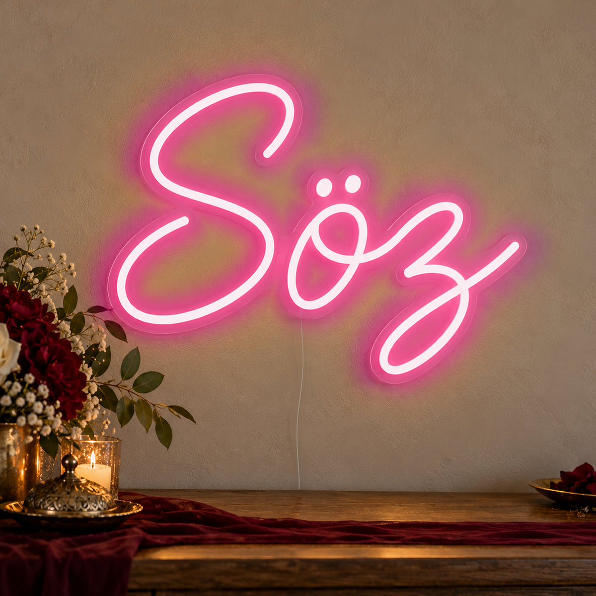 Söz Neon Sign in rose red LED neon on clear acrylic, angled view