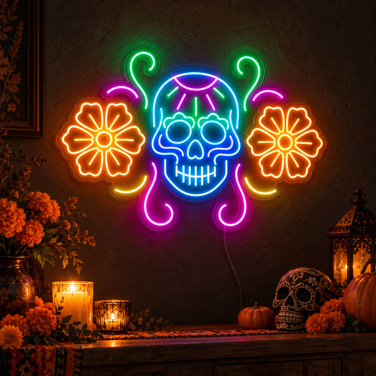 Sugar Skull with Flowers Neon Sign featuring a blue sugar skull flanked by orange flowers, with pink and green decorative curves, glowing on a dark wall in a Halloween room display.
