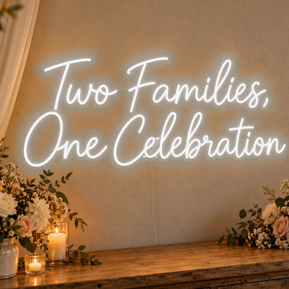 Two Families One Celebration Neon Sign in white LED neon on clear acrylic, angled view