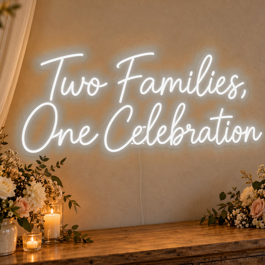 Two Families One Celebration Neon Sign in white LED neon on clear acrylic, angled view