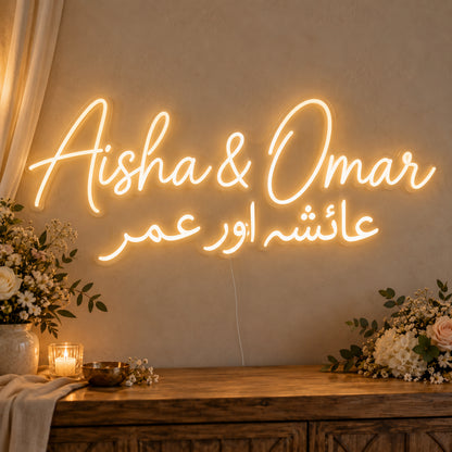 Personalised Two Script Names Neon Sign on clear cut-to-shape acrylic in an illuminated wall display; example personalisation shown.