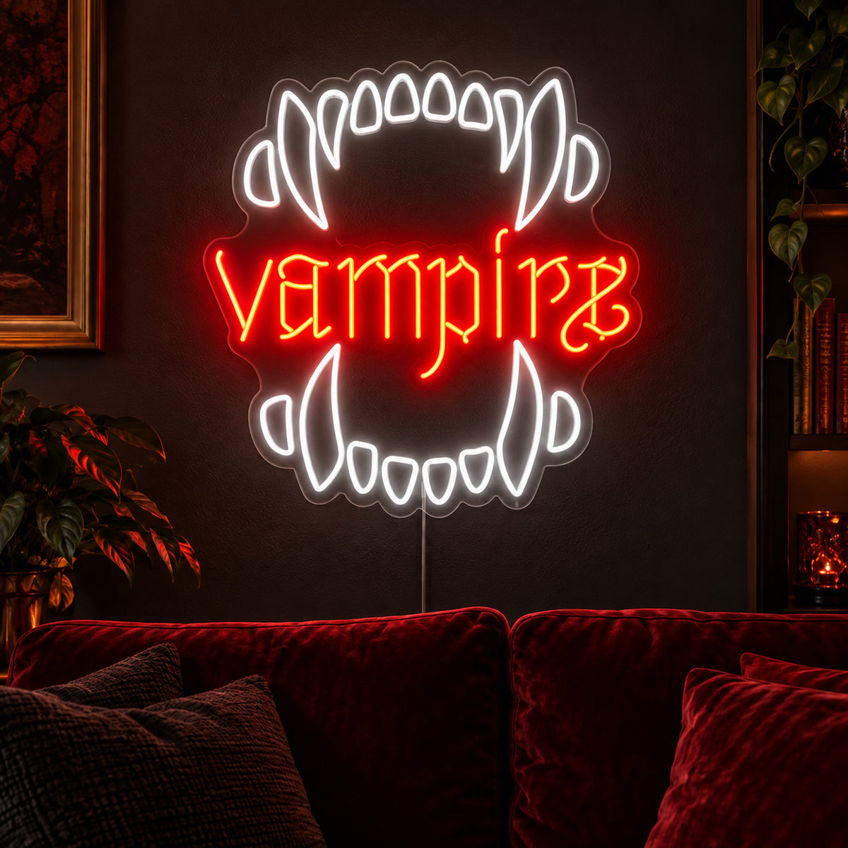 Vampire Fangs Neon Sign featuring white upper and lower fangs surrounding red Vampire lettering, glowing on a dark living room wall.
