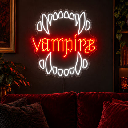 Vampire Fangs Neon Sign featuring white upper and lower fangs surrounding red Vampire lettering, glowing on a dark living room wall.