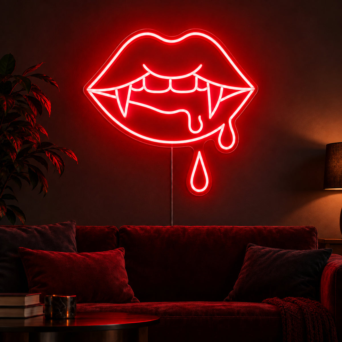 Vampire Lips with Double Blood Drops Neon Sign featuring red lips with pointed fangs and two hanging blood drops, glowing on a dark living room wall.