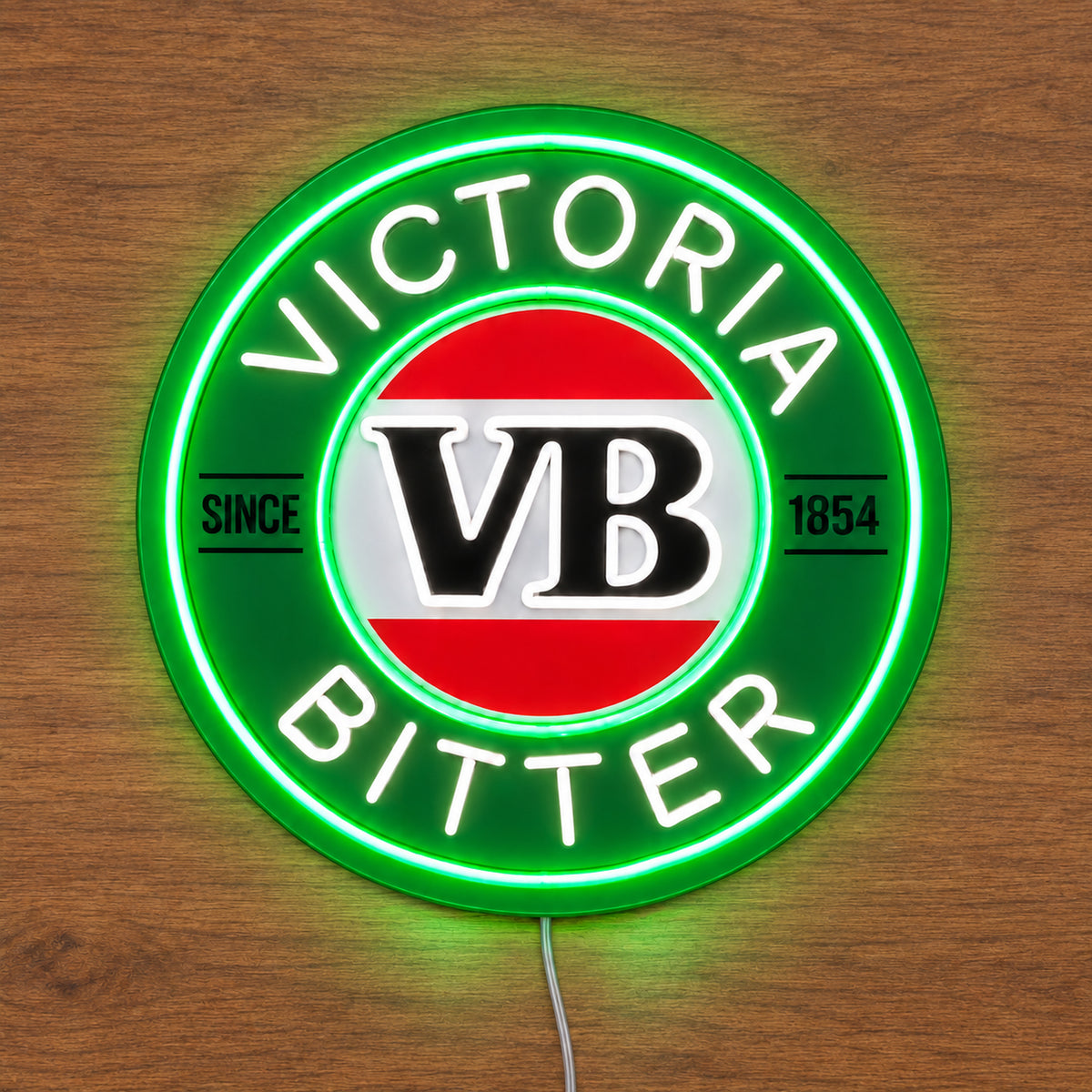 Victoria Bitter neon sign glowing on a wooden surface