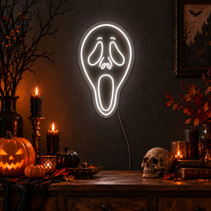 White Ghostface Neon Sign featuring the elongated Ghostface mask outlined in white, with drooping eyes and an open mouth, glowing on a dark wall in a Halloween room display.