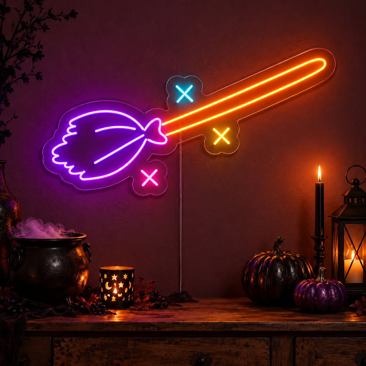 Witch Broom Neon Sign featuring a purple broom head, an orange handle and colourful sparkle details, glowing on a dark wall in a Halloween room display.